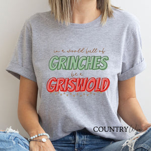 In A World Full Of Grinches Be A Griswold T-Shirt - Heather Gray (Unisex)