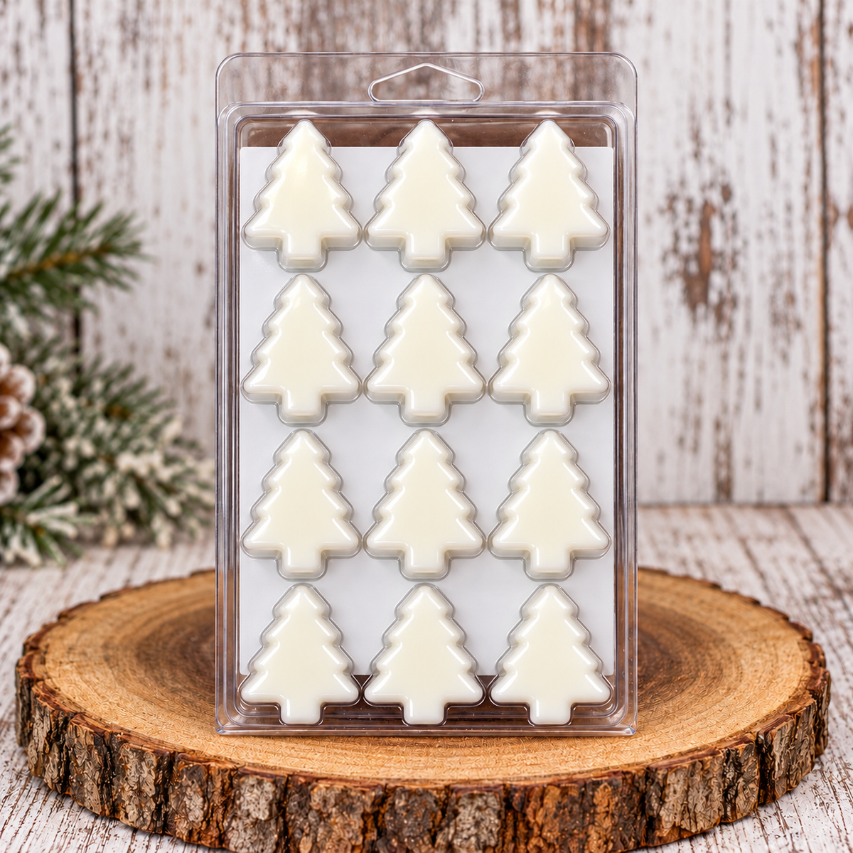 Back of Country Wyx 12 Days of Christmas Wax Melts showing 12 white Christmas tree-shaped wax melts arranged in four rows of three in clear packaging.