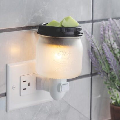 Glass mason jar pluggable wax warmer with a matte black warming dish