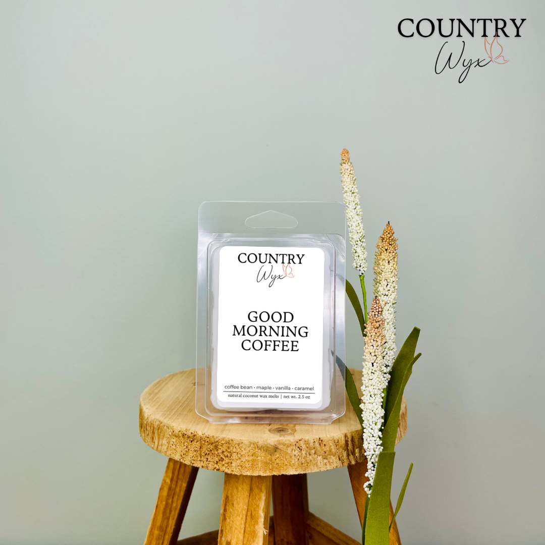 Good Morning Coffee wax melt by Country Wyx displayed on a wooden stool with a soft farmhouse-inspired background